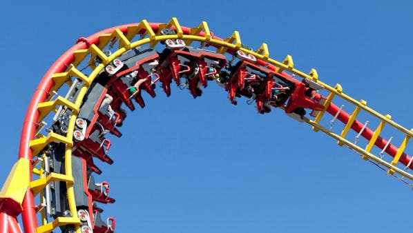 rollercoaster against blue sky