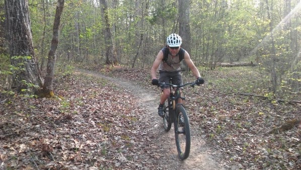 Advanced cyclist David Lanchiniet rides on the Haw Ridge trails for the first time.