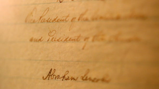 The signature of Pres. Abraham Lincoln is seen on the handwritten copy of the Thirteenth Amendment at the National Underground Freedom Center. The Thirteenth. Amendment was the federal law passed on Jan. 31, 1865, which abolished slavery and involuntary servitude.