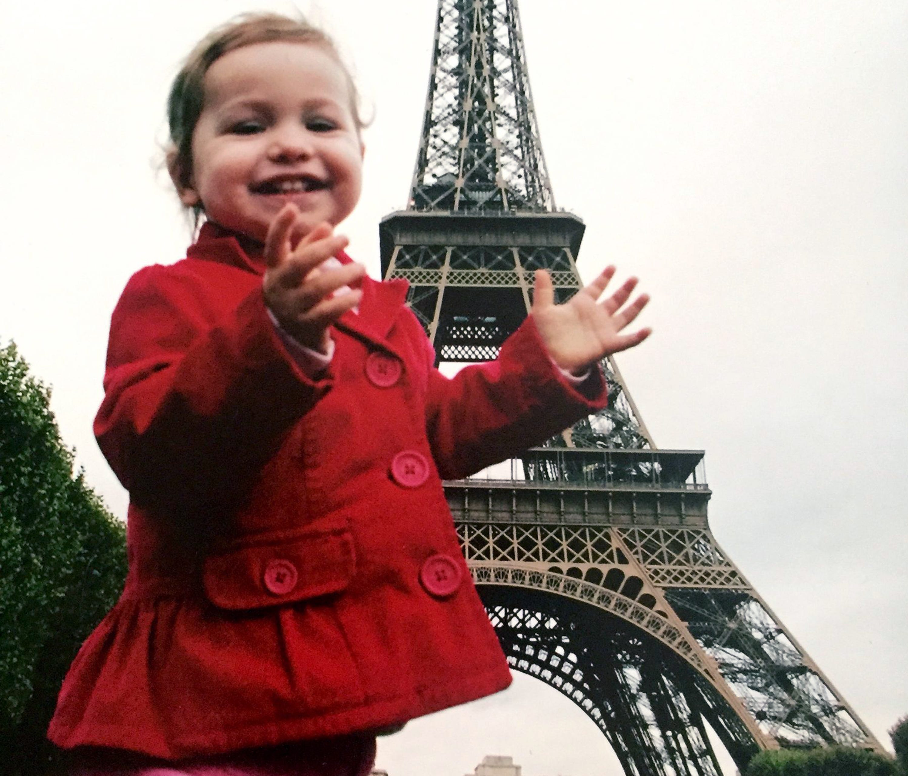 Julia Shamus, 18 months, claps with joy in October 2006 at the base of the Eiffel Tower in Paris.
