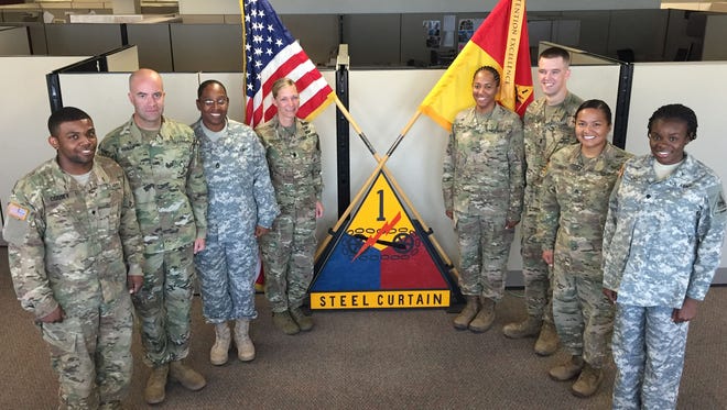 Lt. Col. Robin-Desty Husted, center left, stands with her staff from the Special Troops Battalion. Husted took over the unit on June 29.