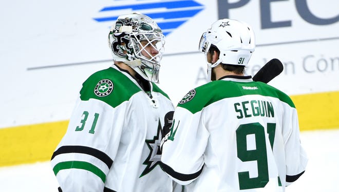 Dallas Stars goalie Antti Niemi (31) and center Tyler Seguin (91)  celebrate the win against the Philadelphia Flyers at Wells Fargo Center. The Stars defeated the Flyers, 2-1.