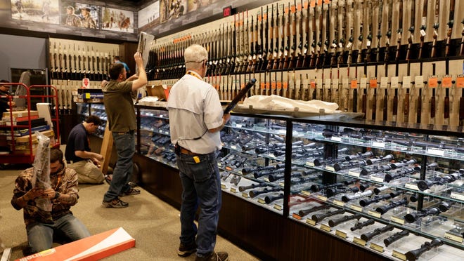 Employees stock guns at a Dick’s Sporting Goods store in Lafayette, La., in 2016. Dick’s has announced it will no longer sell assault-style weapons. LEE CELANO/THE ADVERTISER Employees stock guns at DICK'S Sporting Goods and Field and Stream stores in Lafayette, Louisiana, in 2016.