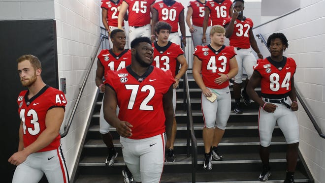 Players arrive to meet and sign autographs with their fans doing Georgia's Football Fan Day at the Payne Indoor Athletic Facility in Athens, Ga., on Saturday, August 3, 2019.