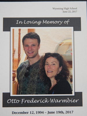 The cover program from Otto Warmbier's funeral at Wyoming High School. The photo is he and his mom, Cindy. Warmbier, 22, died Monday, less then a week after being returned from North Korea in a coma, where he had been imprisoned for more than a year. More than a thousand people turned out to celebrate Otto's life. The University of Virginia student had been in North Korea as part of a tour group. 