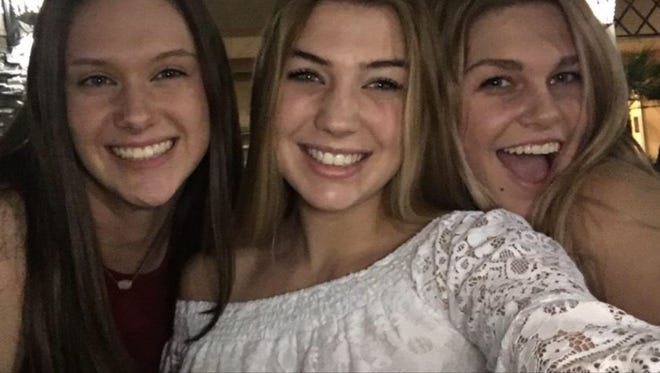 Alex DePriest (in middle flanked by Abby Hansen (left) and Madi Garner (right).