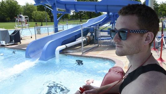 A lifweguard watches swimmers at Chambersburg Memorial Pool in the summer of 2016, the last season the 1970s pool will be open. A new Family Aquatic Center will be built next year.