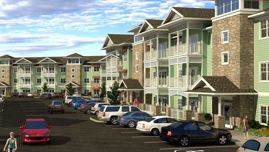 A rendering of what the three-story apartment buildings will look like in Willoughby Estates, a $38-million apartment complex being built in Holt.