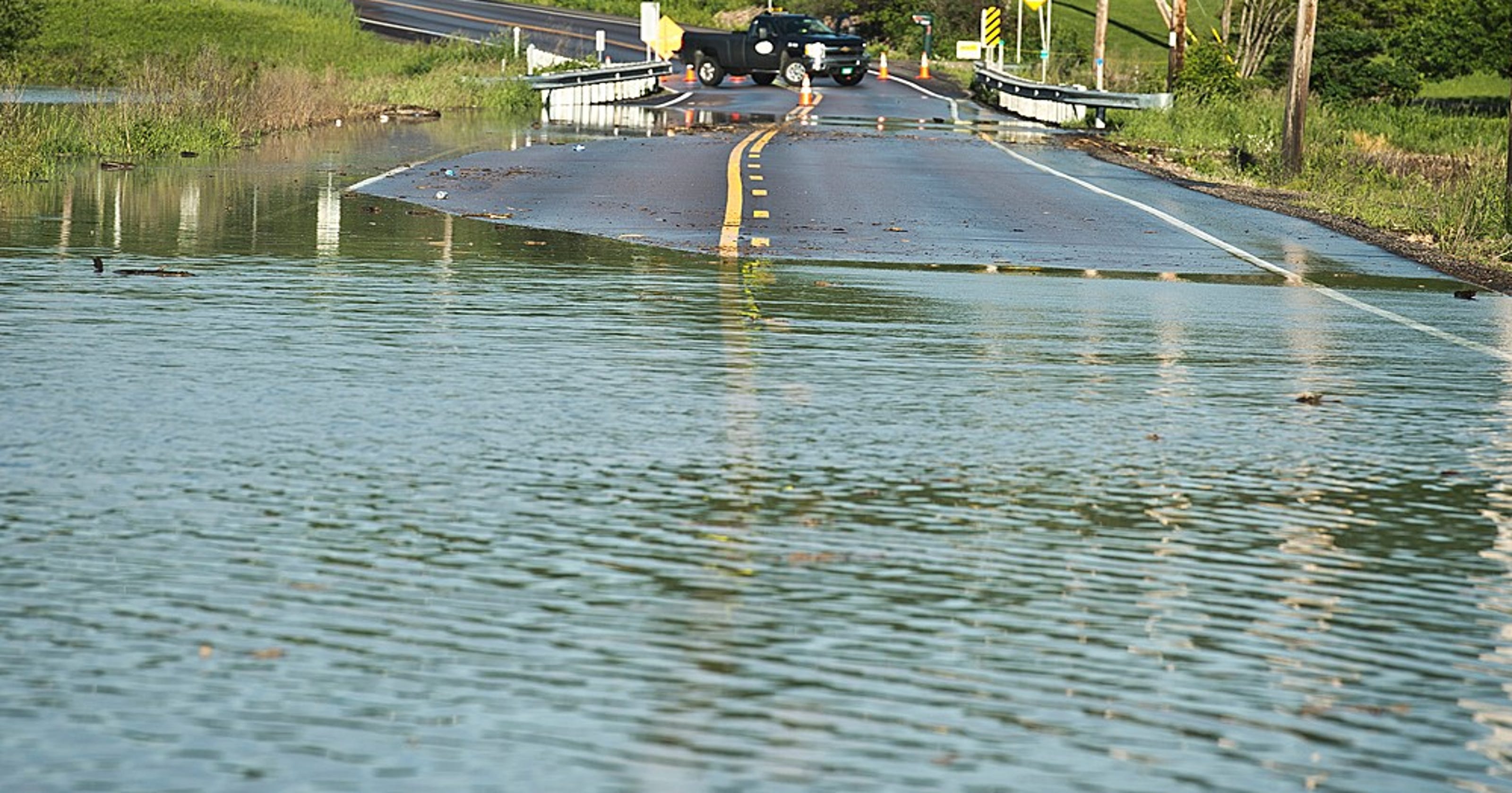 Floods cause water main damage road closures