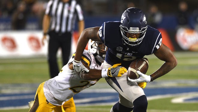 Nevada's Hasaan Henderson makes a catch during the Wolf Pack's game against Wyoming on Saturday.