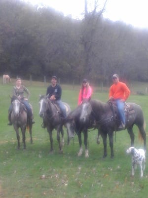 Darin Hampton, Mya Riniker, Traci Wilkinson and Tim Roelefson gather at the 31st annual Pie Ride, reuniting four colts sired by CR Smokes Midnight.