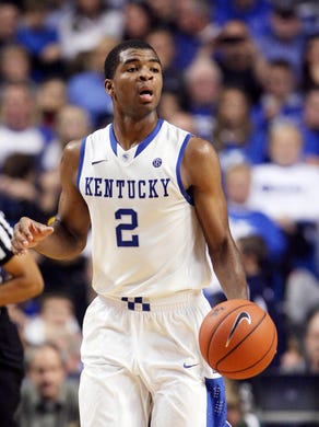 Kentucky Wildcats guard Aaron Harrison dribbles the ball against the East Michigan Eagles during the second half.