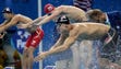 Nathan Adrian (USA) dives in for the final length during