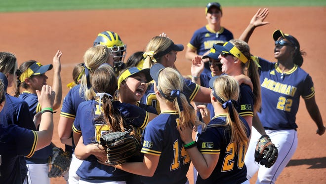 Michigan players celebrate their win over Notre Dame on Sunday.