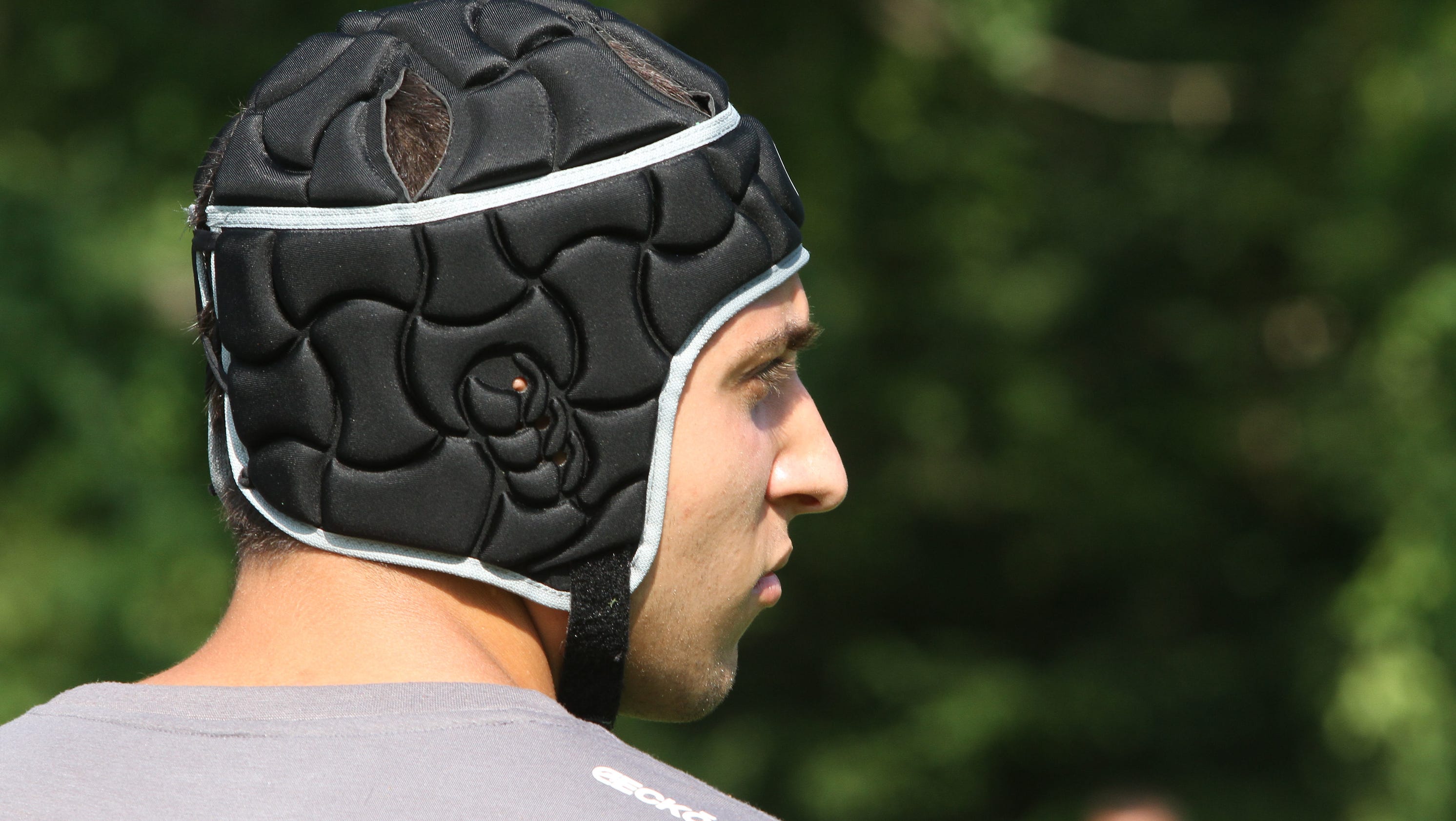 Soccer helmets' use promoted, questioned