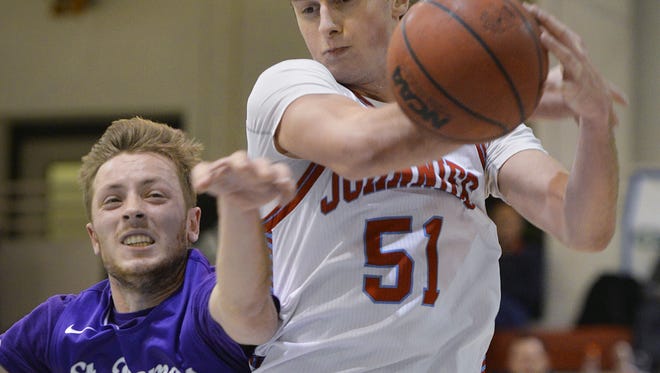 St. John's sophomore Tyler Weiss comes down with a rebound in his team's matchup against St. Thomas earlier this season. The Shakopee graduate went into play against Hamline Wednesday night with five double-doubles so far this season.