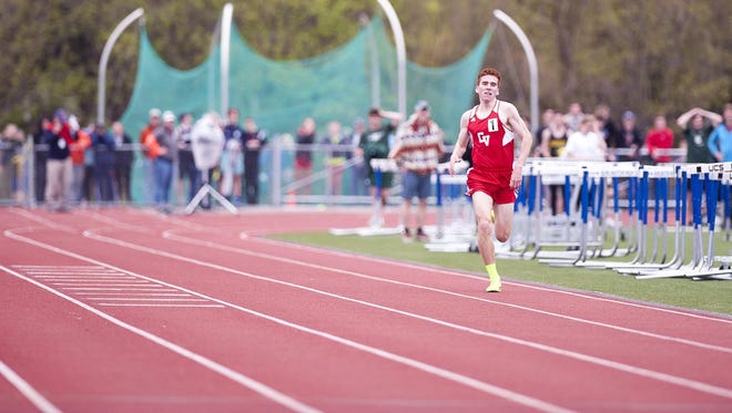 Champlain Valley’s Tyler Marshall is all alone down the home stretch en route to winning the boys 1,500 meters in state-record time at the Burlington Invitational track meet on Saturday at D.G. Weaver Athletic Complex. Marshall finished in 3:56.18.