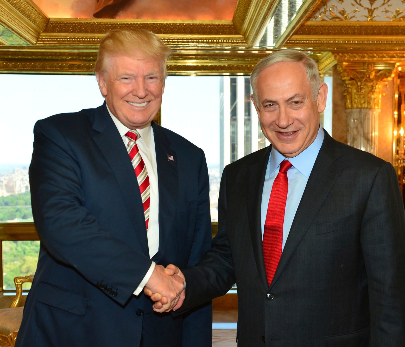 In this handout photo made on Sunday, Sept. 25, 2016, provided by the Israeli Government Press Office, Republican Presidential candidate Donald Trump shakes hand with Israeli Prime Minister Benjamin Netanyahu in New York.
