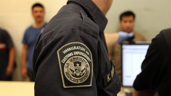 Undocumented Mexican immigrants are photographed while being in-processed at the Immigration and Customs Enforcement (ICE), center on April 28, 2010 in Phoenix, Arizona. ICE announced on Thursday that they arrested 84 undocumented immigrants as part of a targeted operation in Oregon, Washington and Alaska.