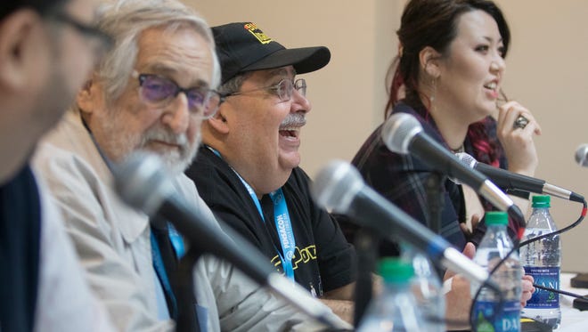 Jose Delbo, left to right, Tony Isabella, and Nen have a laugh during the Diversity in Comics panel discussion during PensaCon in Pensacola on Saturday, February 24, 2018.