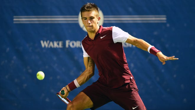 Borna Coric of Croatia returns a shot from Santiago Giraldo of Colombia during the first day of the Winston-Salem Open on Aug. 24, 2015 in Winston-Salem, North Carolina.