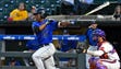 Duke's Kennie Taylor (15) connects with a pitch during