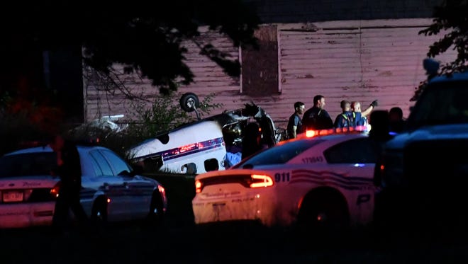 Detroit police and fire department personnel at the scene of a small plane crash in the 7500 block of Milton Street in Detroit on June 24, 2018.