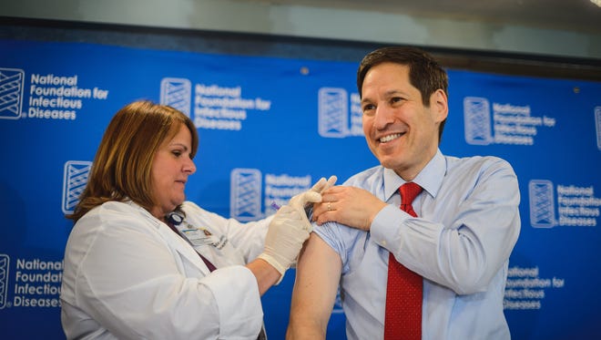 Thomas Frieden, director of the Centers for Disease Control and Prevention, gets his flu shot Thursday.