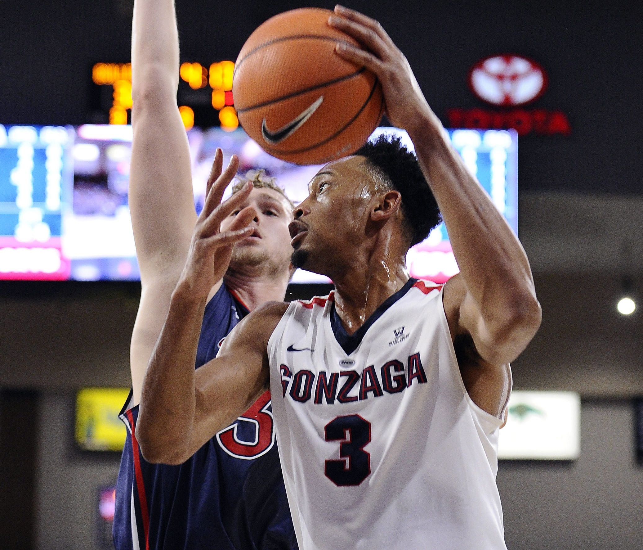 Gonzaga Bulldogs forward Johnathan Williams (3) shoots the basketball against St. Mary's Gaels center Jock Landale (34) during the first half at McCarthey Athletic Center.