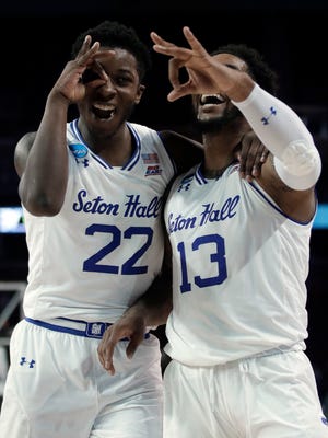 Seton Hall guards Myles Powell, right, and Myles Cale, left, celebrate following an NCAA college basketball tournament first-round game against North Carolina State, Thursday, March 15, 2018, in Wichita, Kan. Seton Hall defeated North Carolina State 94-83.
