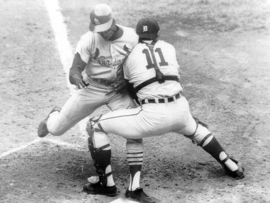Tigers catcher Bill Freehan puts the tag on Cardinals speedster Lou Brock at home plate in the fifth inning of Game 5 of the World Series at Tiger Stadium, Oct. 7, 1968.