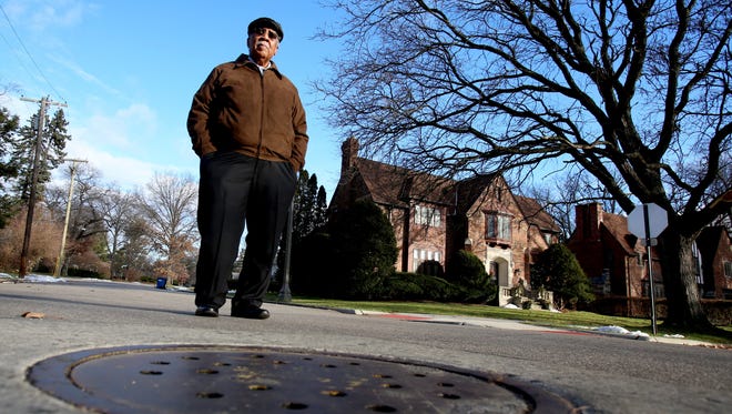 James Heath, 83 of Detroit worked for thirty-nine and a half years at the Detroit Water and Sewerage Department some of which was as the assistant director of water operations.
Heath stands in front of one manhole cover on a street in the Palmer Park area of Detroit on Friday, December 30, 2016.
He has lots on his mind and lots to say about the lack of inspections on the 15 Mile line that has resulted in two sinkholes during the past 12 years and three in the entire history of the line.