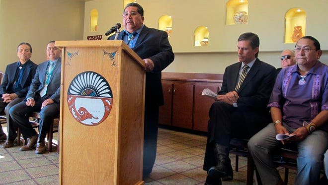 In this Tuesday, July 5, 2016, photo, Val Panteah, Gov., of Zuni Pueblo in New Mexico, discusses legislation in Albuquerque, N.M.. Sen. Martin Heinrich, second from right, plans to propose the legislation that would prohibit items considered sacred by Native Americans and protected by U.S. laws from being exported to international markets. The push for a federal law that would prohibit Native American items protected by U.S. laws from being exported to international markets comes under scrutiny as tribal leaders try to defend the proposal. The governor of Acoma Pueblo and others are planning a news conference Friday, Aug. 11, 2016, to discuss the law.