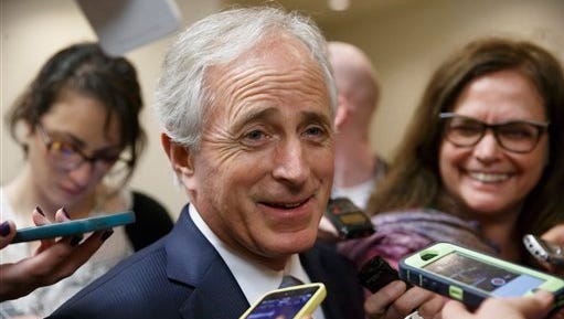 Senate Foreign Relations Committee Chairman Bob Corker, R-Tenn., answers questions from reporters on the way to a floor vote at the Capitol in Washington, Monday, Feb. 9, 2015.  (AP Photo/J. Scott Applewhite)