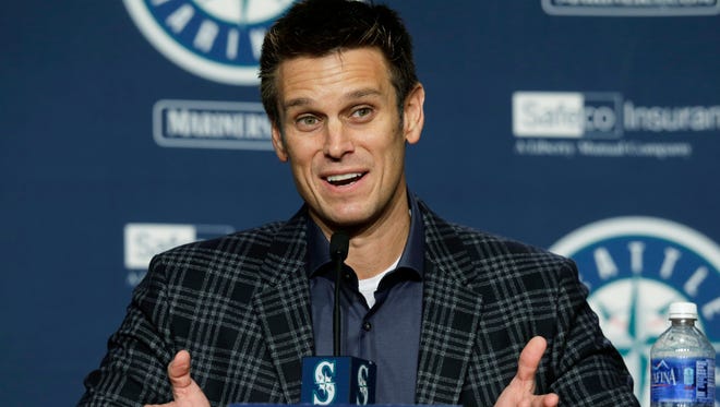 Seattle Mariners general manager Jerry Dipoto talks to reporters in Seattle. From the chair of new general manager Jerry Dipoto, to first-time manager Scott Servais and down to the 25th man on the bench, Seattle is essentially an entirely new team.