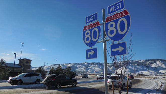 Morning traffic slogs along Robb Drive near Interstate 80 in northwest Reno as ice continued to dog drivers on Friday, Jan. 15.