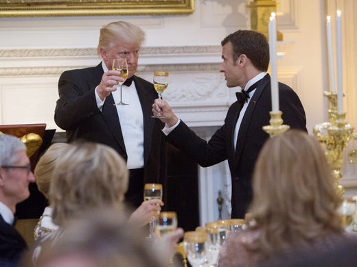 President Trump shares a toast with French President