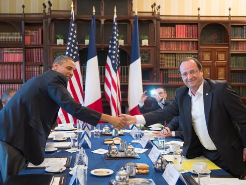 President Obama shakes hands with French President Francois Hollande during a bilateral meeting on the sidelines of the G8 summit June 18.