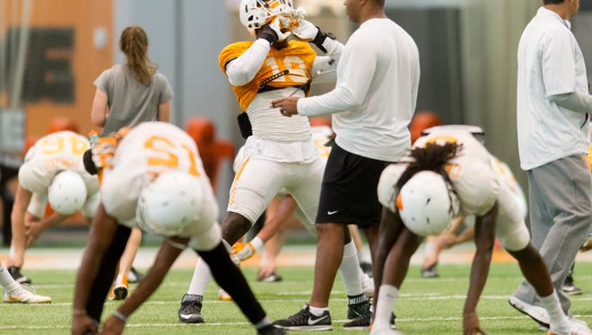 Tennessee's Darrell taylor (19) wipes his forehead during Tennessee Volunteers spring practice at Anderson Training Facility in Knoxville, Tennessee on Tuesday, April 18, 2017.