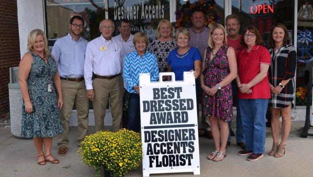 Designer Accents was presented the Sturgis Chamber of  Commerce's Best Dressed Award today, Wednesday, October 5.  Pictured from the right are chamber members Nyra Syers; Garrick Thompson; Garland Certain; Mike Cowan; Carlene Thomas; Barb Gorman' Designer Accents owner Samantha Omer; Doug Rodgers; Sturgis Chamber President Dr. Kate Baker; William Thomas; Sturgis Chamber office Manager Lisa Jones; and Shannon Clements.  Designer Accents is the  first recipient of the new  award.