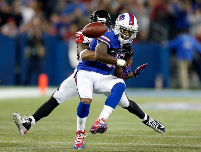 
Buffalo Bills wide receiver Stevie Johnson fumbles as he is tackled by Atlanta Falcons cornerback Robert McClain during the Bills final drive in regulation.
