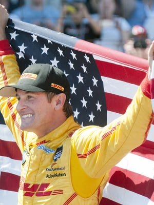 Ryan Hunter-Reay celebrates at the yard of bricks after winning the 98th running of the Indianapolis 500 Sunday, 5/25/14