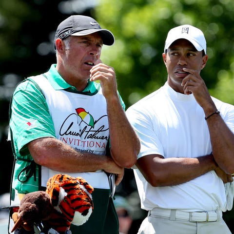 Tiger Woods, right, and former caddie Steve...