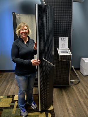Denise Molesky, owner of Quickfix Cryo, shows her cryotherapy chamber. Using liquid nitrogen at 220 degrees below zero, the device cools patients for sessions that are said to provide pain relief for those who suffer from inflammatory conditions. The business is located at 2848 Second St. S in St. Cloud.