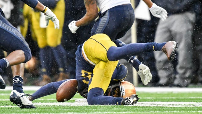 Nov 18, 2017; South Bend, IN, USA; Notre Dame Fighting Irish wide receiver Equanimeous St. Brown (6) lands hard after an incomplete pass in the first quarter against the Navy Midshipmen at Notre Dame Stadium. St. Brown left the game after being injured on the play. Mandatory Credit: Matt Cashore-USA TODAY Sports