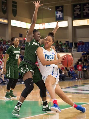Erica Nelson of Florida Gulf Coast University drives past Brandi Buie of Jacksonville during the game at FGCU on Saturday afternoon, Jan. 28, 2017.