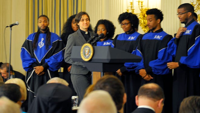 The Rev. Jasmine Beach-Ferrara, executive director of the Asheville, N.C.-based  Campaign for Southern Equality, walks up to the podium for a Bible reading March 30, 2016, during the White House Easter prayer breakfast in Washington.