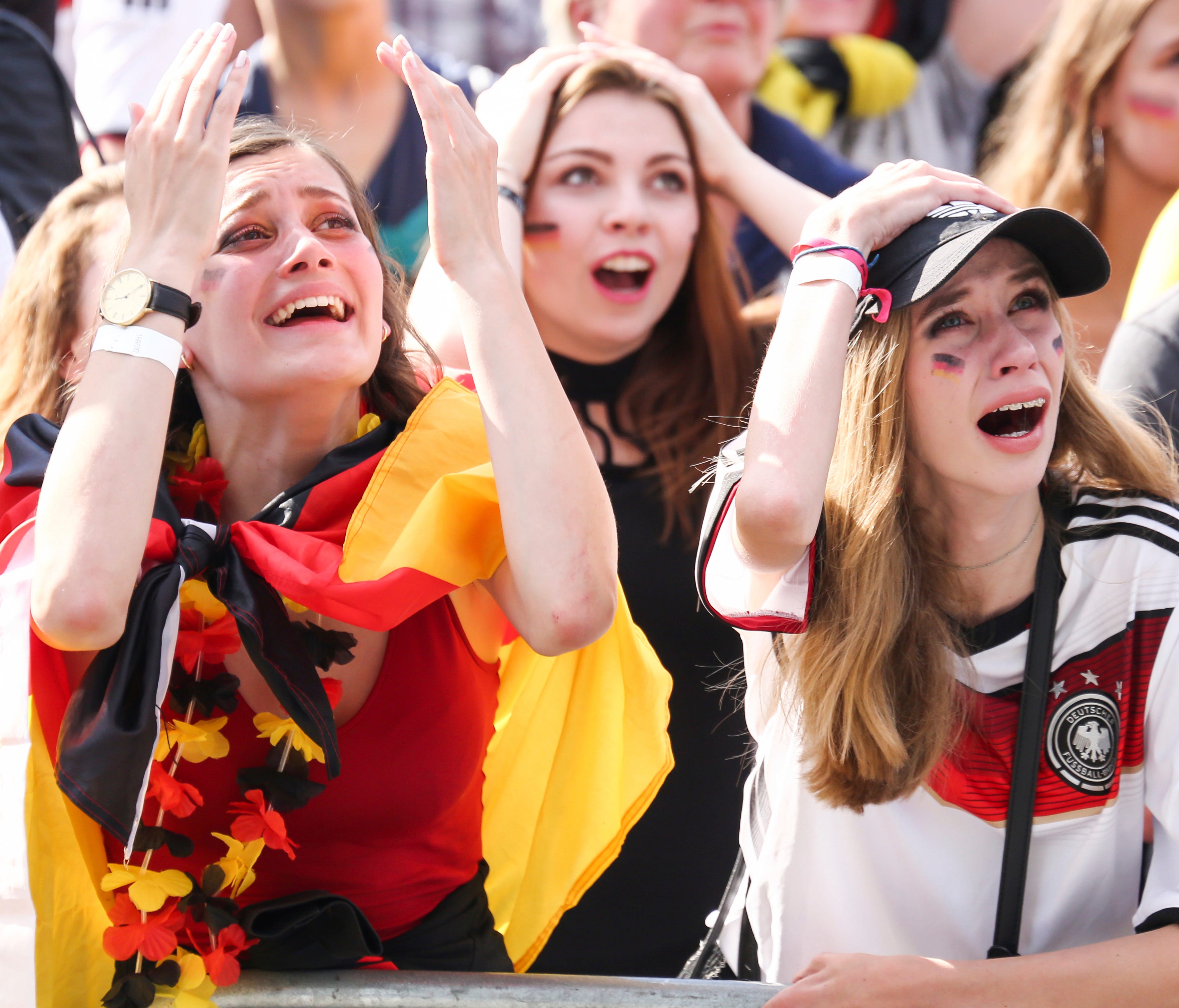 Fans react after Germany was eliminated from the World Cup as they watch in Hamburg.