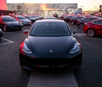 Model 3 units ready for delivery at Tesla's first delivery event in July.
