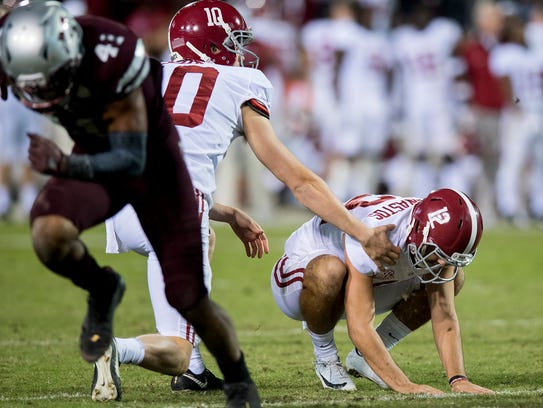 Alabama kicker Andy Pappanastos (12) reacts to missed
